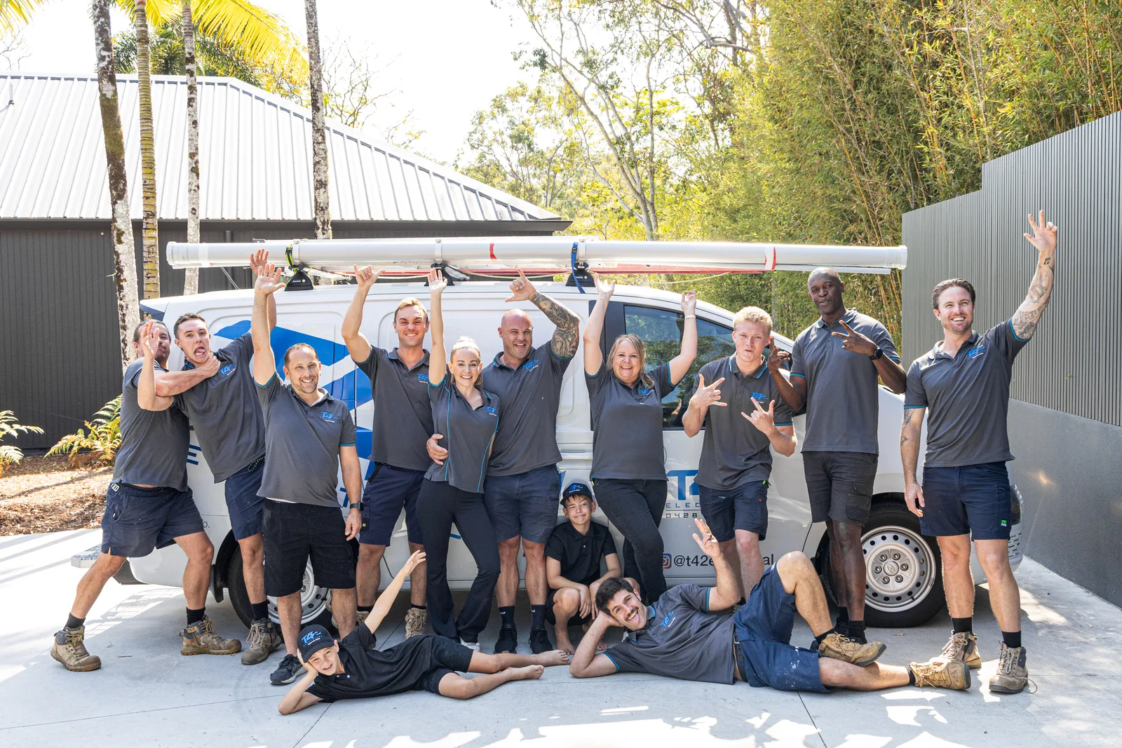The local family-run air conditioning team celebrating a finished job